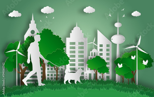 Paper art style of landscape with eco green city, young man walking his dog in a park, save the planet and energy concept, flat-style vector illustration.