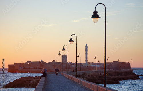 Causeway to the Castle of San Sebastian Castillo de San Sebastian at twilight - Cadiz, Andalusia, Spain