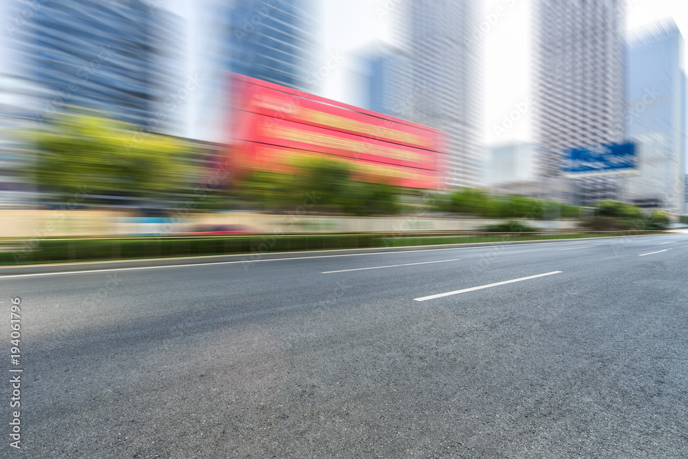 city empty traffic road with cityscape in background.