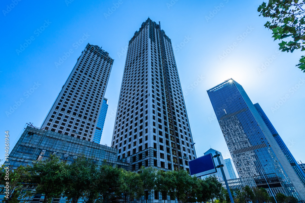 low angle view of skyscrapers in city of China. low angle view of skyscrapers in city of China.