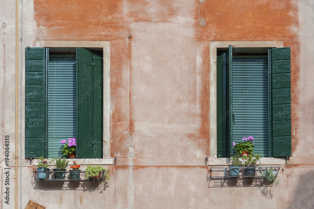 Window of old residential building in Venice, Italy