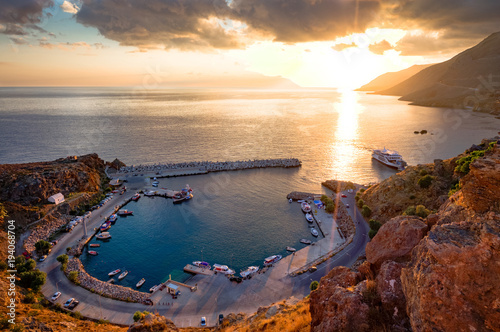 boats in the port of Chora Sfakion at sunset. A view of the port and the sea from the mountain. Greece