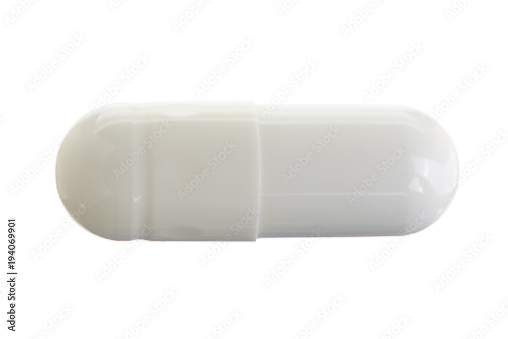 white pill capsule isolated on white background macro. Top view