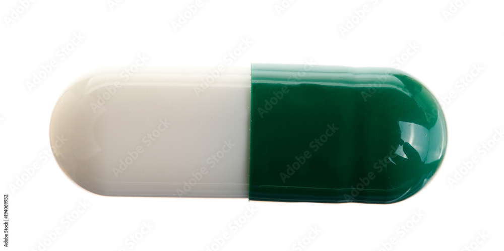 white pill capsule isolated on white background macro. Top view white pill capsule isolated on white background macro. Top view