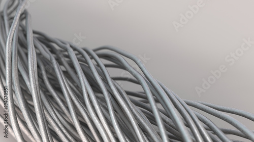 Twisted aluminum wires on white surface