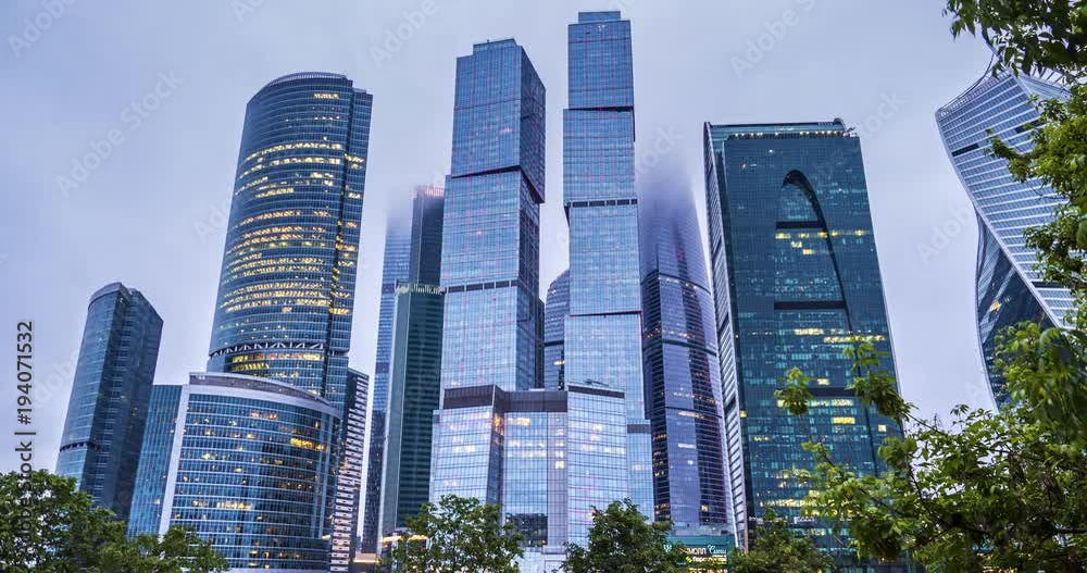 Time-lapse skyscraper in the city under floating clouds Time-lapse skyscraper in the city under floating clouds