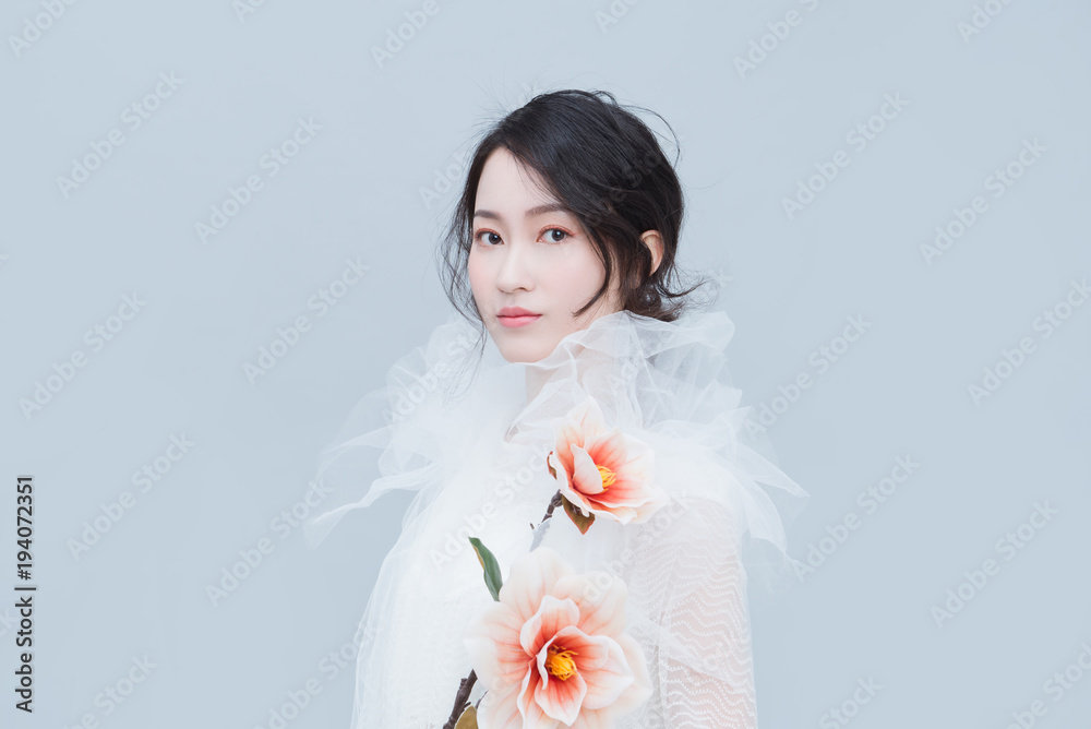 Chinese young woman with flower