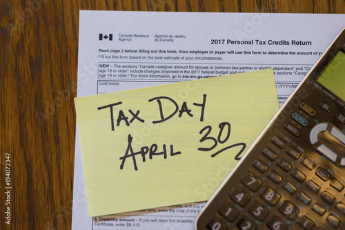 Tax Form with Sticky note with Deadline close up photo