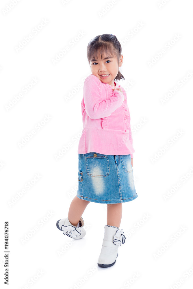 Full length of a little asian girl standing over white background Full length of a little asian girl standing over white background
