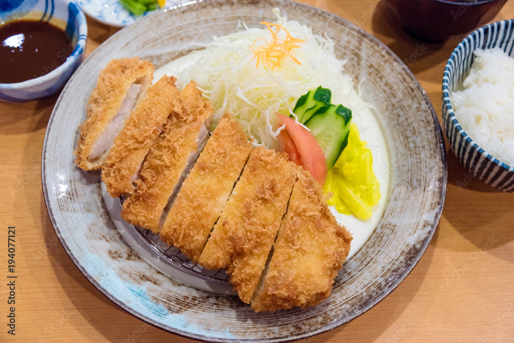 Tonkatsu,Japanese style Deep fried pork with vegetables, rice,sauce and soup. Tonkatsu,Japanese style Deep fried pork with vegetables, rice,sauce and soup.