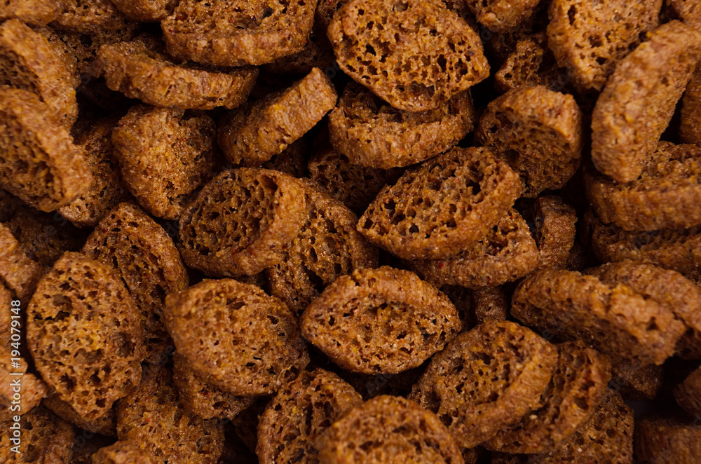 Roasted pieces dry brown bread as background, top view, closeup.. Roasted pieces dry brown bread as background, top view, closeup..