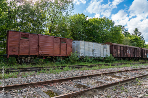 Old abandoned cargo train set standing on some old tracks