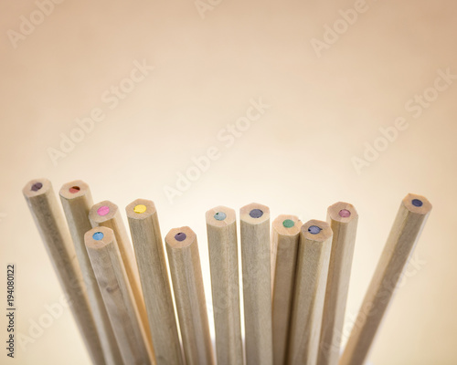 Colors pencils on brown background. A group of wooden pencils color.