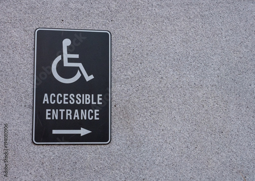 Accessible Entrance sign on side of building