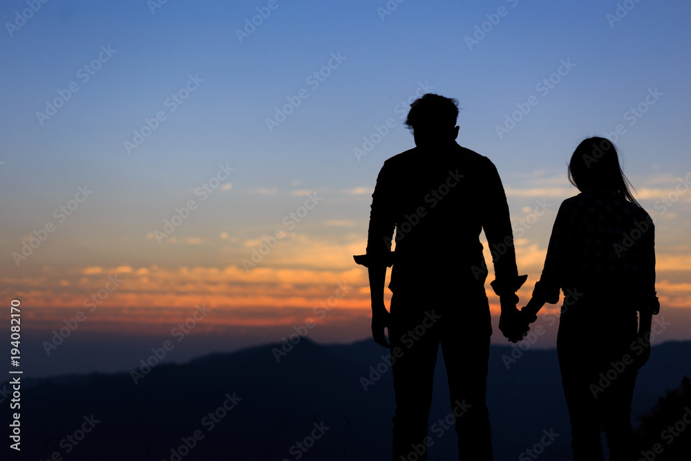 two people Couples in love at sunset.