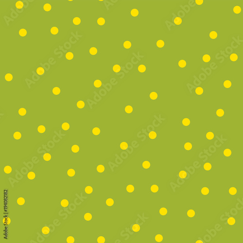Yellow polka dots seamless pattern on green background. Magnificent classic yellow polka dots textile pattern in restrained colours. Seamless scattered confetti fall chaotic decor.