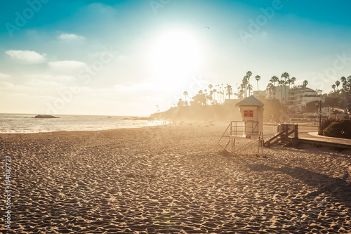 Laguna Beach lifeguard in sunset photo