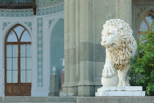 Marble sculpture of lion with ball in Vorontsov Palace in Alupka, Crimea, Russia. photo