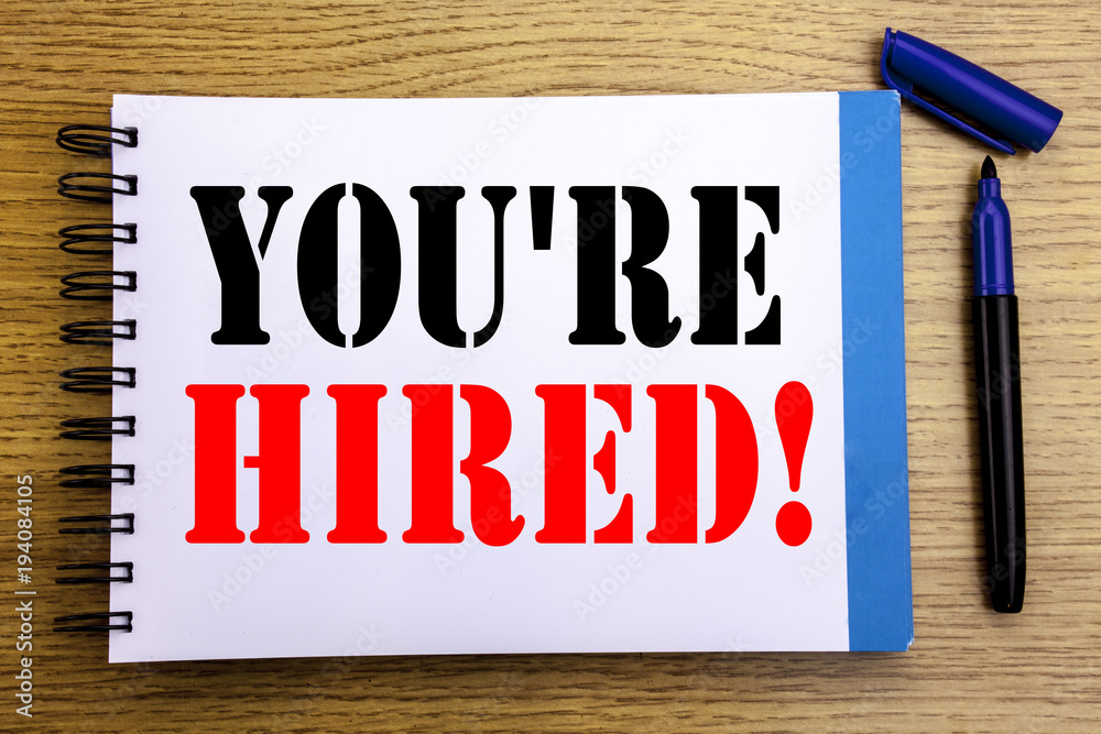 Handwriting Announcement text showing You Are Hired. Business concept for Hiring Employee Worker Written on notepad note paper background with space office view with pencil marker Handwriting Announcement text showing You Are Hired. Business concept for Hiring Employee Worker Written on notepad note paper background with space office view with pencil marker