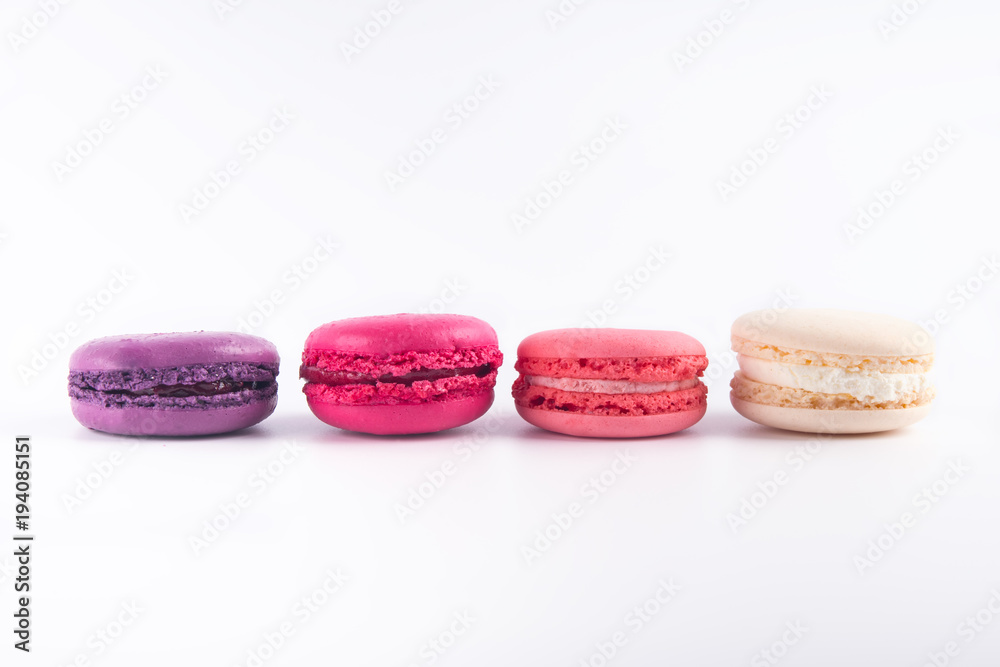 four colorful biscuits macaron hardly on a light background four colorful biscuits macaron hardly on a light background