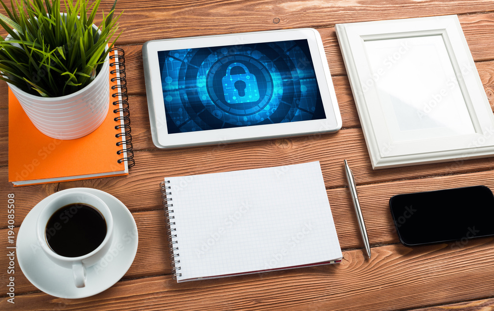 Web security and technology concept with tablet pc on wooden table Web security and technology concept with tablet pc on wooden table