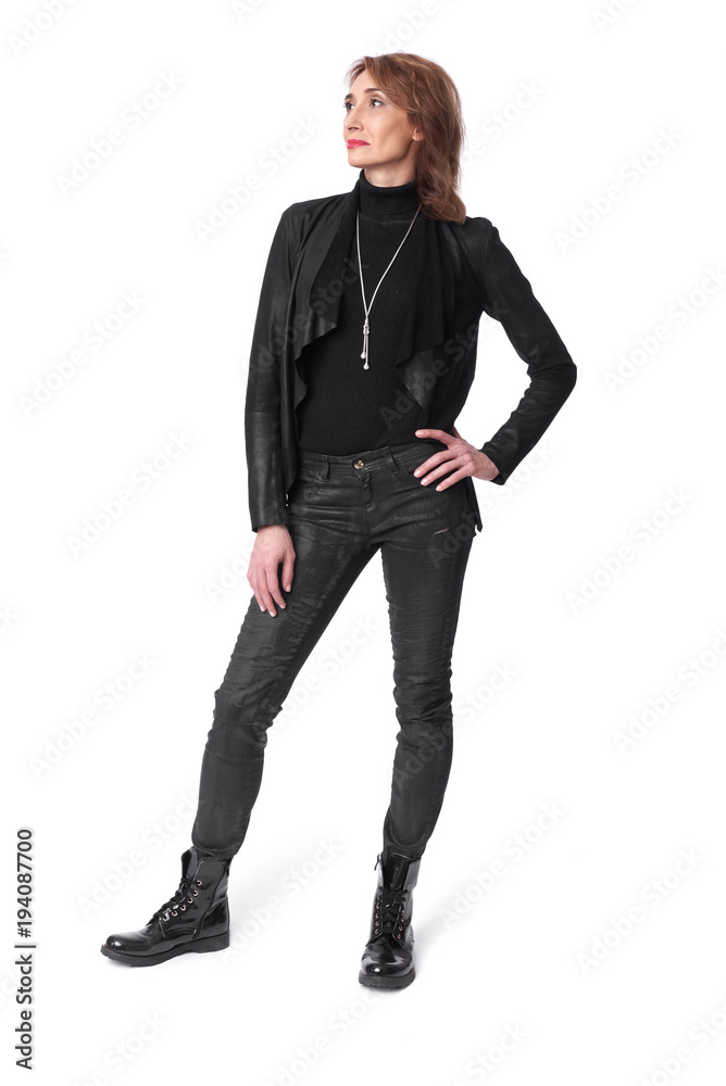 full length of middle aged woman in leather clothes full length of middle aged woman in leather clothes