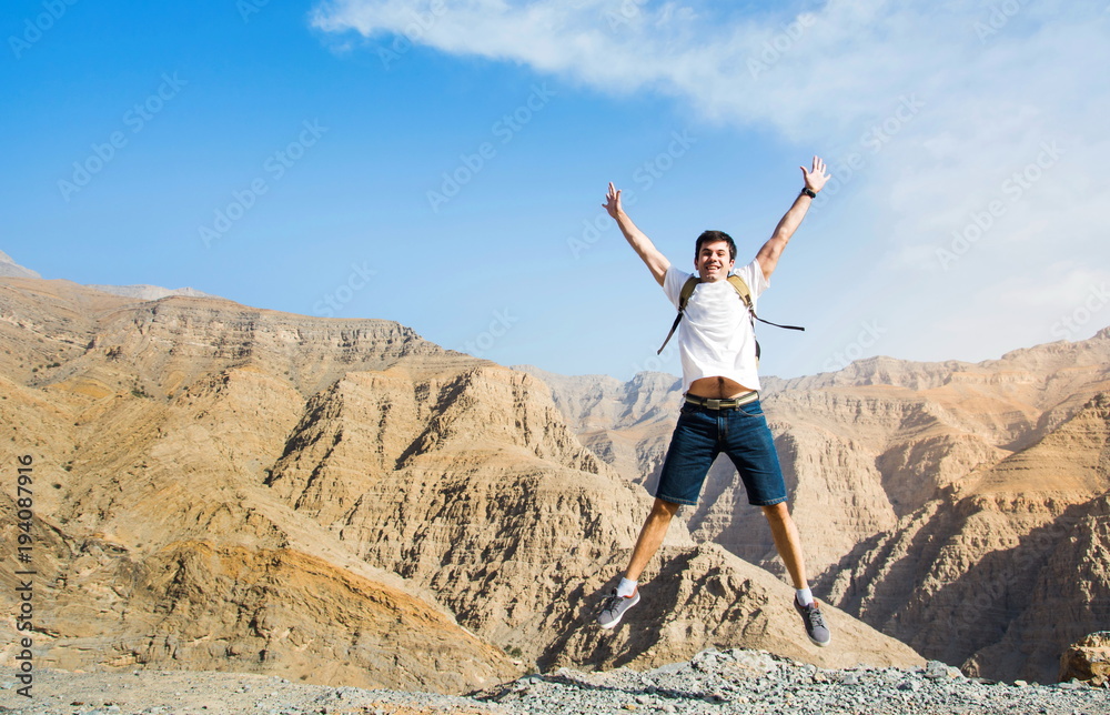 Man jumping on the mountain top Man jumping on the mountain top