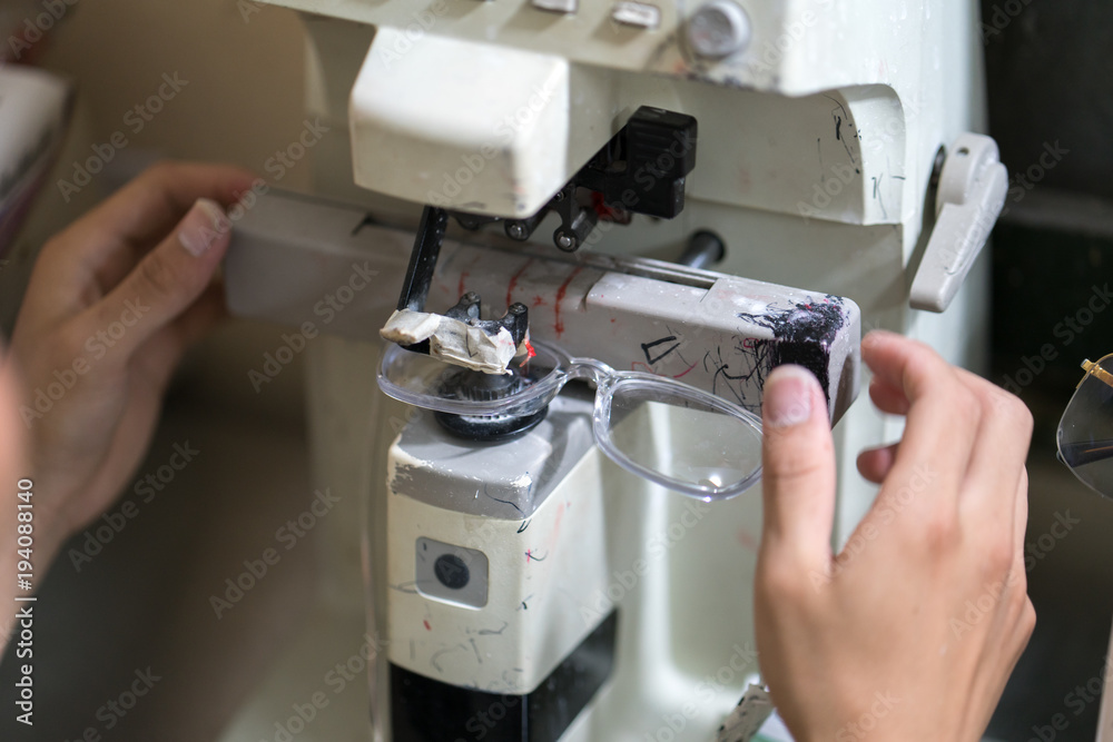 Naklejka premium Eye glasses is making by drilling machine in workshop
