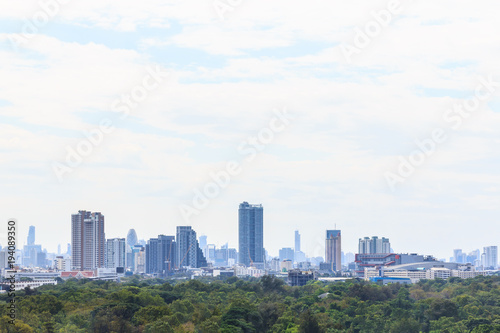 View cityscrape business buildings on blue sky background.