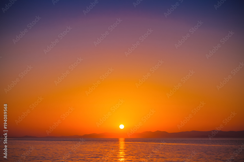 Beautiful sunset in a harbor of small town Postira - Croatia