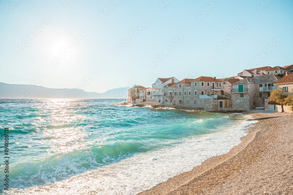 Panoramic view on a beach of a small town Postira - Croatia, island Brac