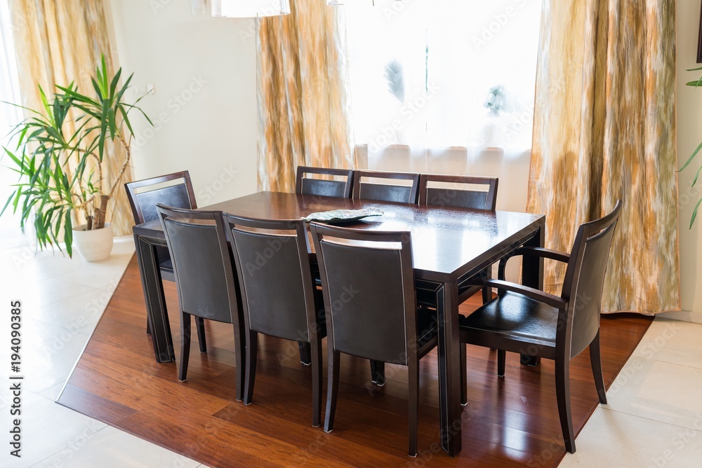 Dining room with big brown table Dining room with big brown table