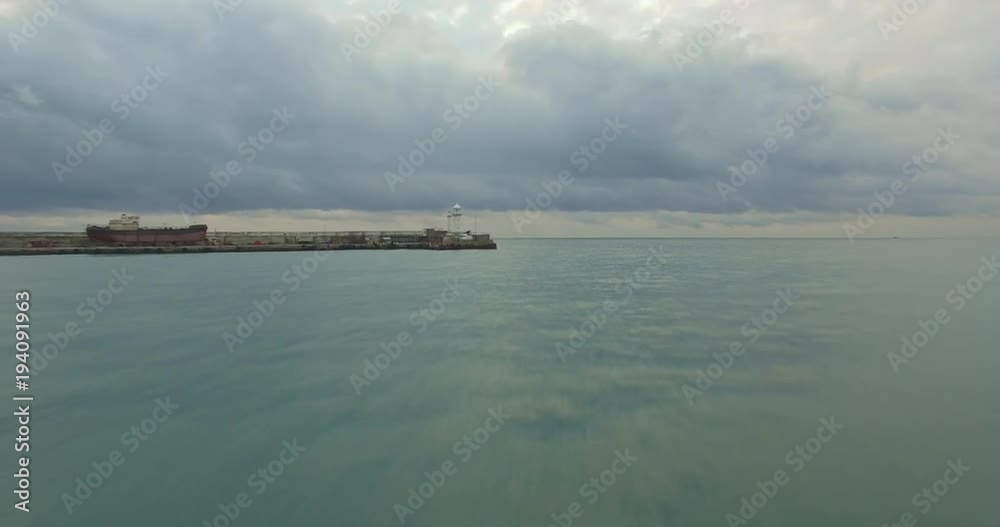 Aerial sea view and lighthouse over the clouds in cam weather Aerial sea view and lighthouse over the clouds in cam weather