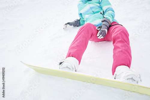 Snowboard, boots and pants closeup