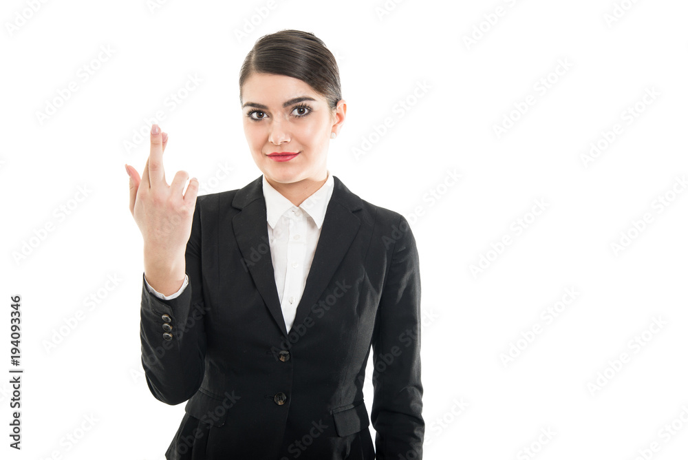 Portrait of beautiful female flight attendant holding fingers crossed Portrait of beautiful female flight attendant holding fingers crossed