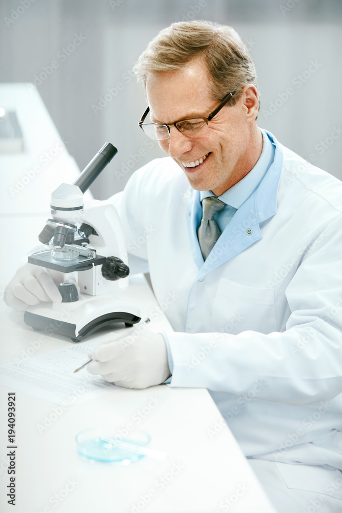 Laboratory. Male Scientist Working At Workplace. Laboratory. Male Scientist Working At Workplace.