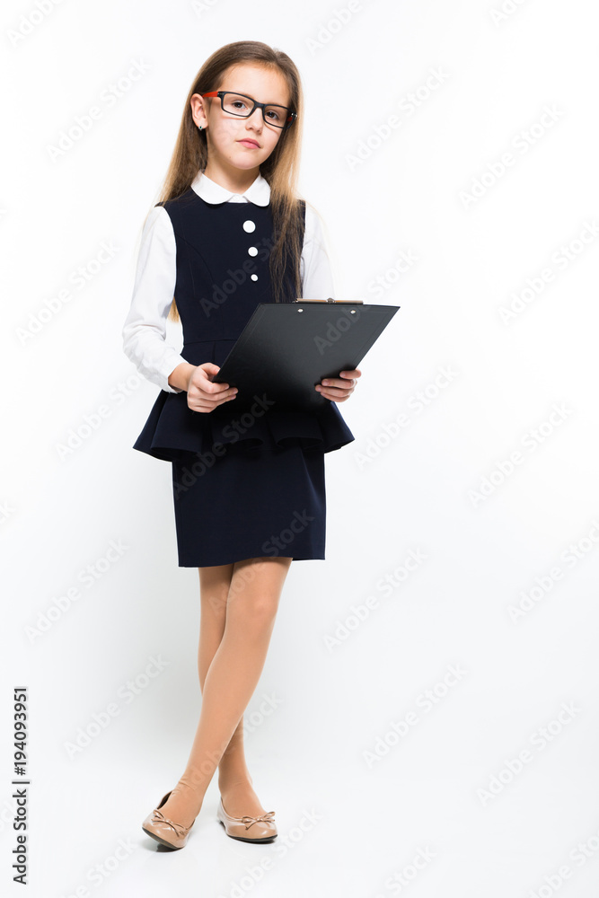 Little girl with clipboard in her hands dressed as a businesswoman Little girl with clipboard in her hands dressed as a businesswoman