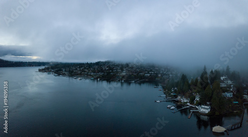 Aerial view of Deep Cove during a cloudy and moddy sunrise. Taken in North Vancouver, British Columbia, Canada.