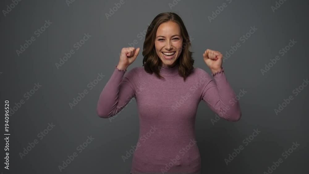 Beautiful woman dancing for joy