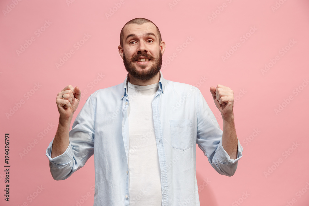 The happy business man standing and smiling against pink background. The happy business man standing and smiling against pink background.