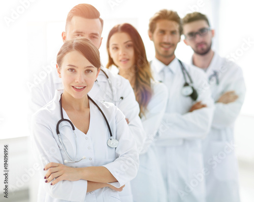 woman-pediatrician on the background of colleagues