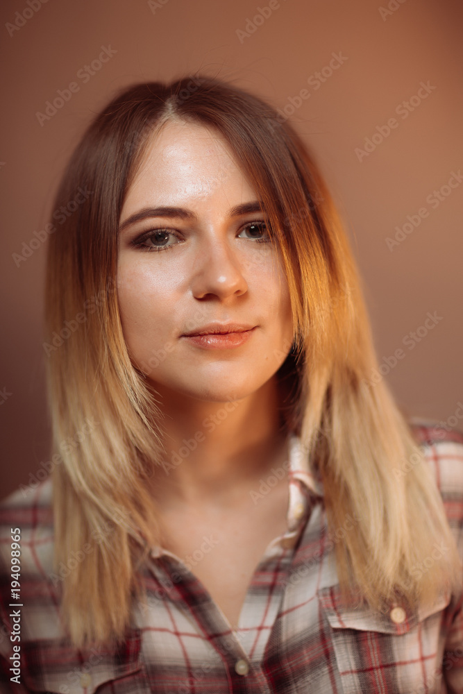 portrait smiling girl on orange background in studio portrait smiling girl on orange background in studio
