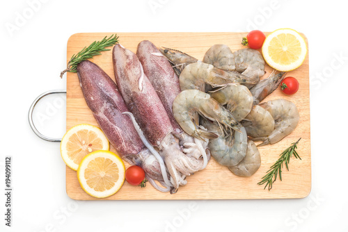 fresh seafood raw (shrimps ,squids) on wooden board