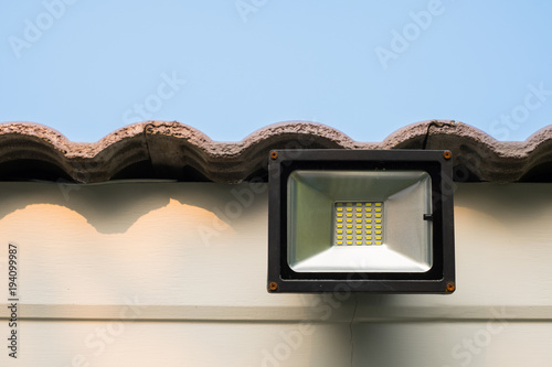 Bilde på lerret LED flood light, spot light on the roof with blue sky background