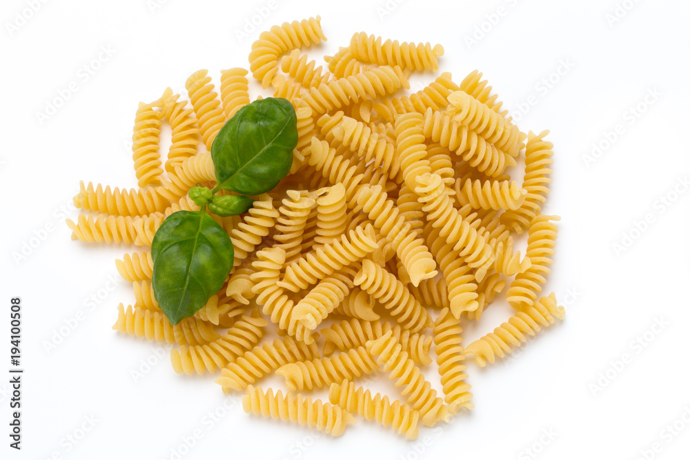 Uncooked fusilli pasta isolated white background. Uncooked fusilli pasta isolated white background.