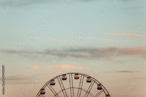 Ferris wheel on the sky background