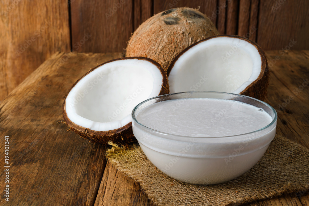 Fresh coconuts on old wooden background Fresh coconuts on old wooden background
