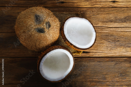 Fresh coconuts on old wooden background, Food top view