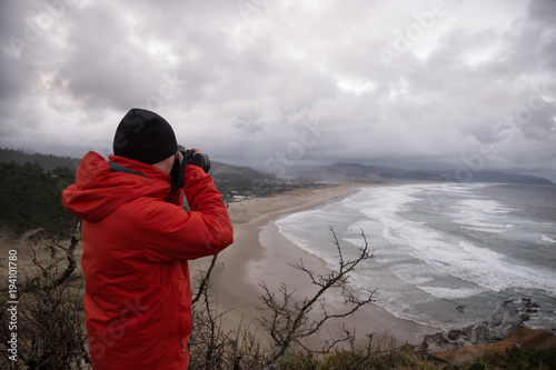 Wallpaper Mural Photographer taking picture of the beautiful seascape on Pacific Ocean Coast. Taken in Cape Kiwanda, Oregon, America Torontodigital.ca