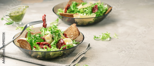 Frisee lettuce salad with sun dried tomatoes